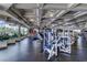 Well-equipped gym with modern exercise machines and large windows overlooking outdoor scenery at 33 Chateau Whistler Ct, Las Vegas, NV 89148
