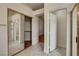 Open hallway features a large mirror and entrances to the bathroom and a walk-in closet at 33 Chateau Whistler Ct, Las Vegas, NV 89148