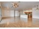 Open-concept living space with hardwood floors connecting the kitchen and living areas at 33 Chateau Whistler Ct, Las Vegas, NV 89148