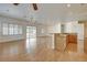 Spacious living room featuring hardwood floors, recessed lighting, and sliding glass doors to the backyard at 33 Chateau Whistler Ct, Las Vegas, NV 89148