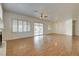Expansive living room with hardwood floors, patio access, and an open layout at 33 Chateau Whistler Ct, Las Vegas, NV 89148
