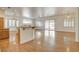 Spacious open-concept living and dining area with wood floors and bright shutters at 33 Chateau Whistler Ct, Las Vegas, NV 89148