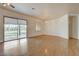 Spacious living room with hardwood floors and slider doors to backyard at 33 Chateau Whistler Ct, Las Vegas, NV 89148
