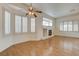 Comfortable living room with fireplace, hardwood floors, and plenty of natural light at 33 Chateau Whistler Ct, Las Vegas, NV 89148