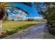 Community park with grassy field, walking path, and benches surrounded by trees at 33 Chateau Whistler Ct, Las Vegas, NV 89148