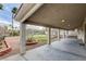 Spacious covered patio with view of the backyard and perimeter landscaping at 33 Chateau Whistler Ct, Las Vegas, NV 89148