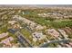 Aerial view of a neighborhood featuring large homes, mature trees, and a manicured landscape at 3680 Belvedere Park Ln, Las Vegas, NV 89141