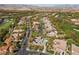 Beautiful aerial perspective of a residential area showcasing mature trees and a stunning golf course at 3680 Belvedere Park Ln, Las Vegas, NV 89141