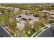 Aerial view showcasing an expansive home with solar panels and landscaped grounds at 3680 Belvedere Park Ln, Las Vegas, NV 89141