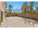 An open backyard features a sports court with a basketball hoop and volleyball net for recreational activities at 3680 Belvedere Park Ln, Las Vegas, NV 89141