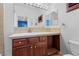 Bathroom featuring a single sink, wooden vanity with drawers, and tile countertops at 3680 Belvedere Park Ln, Las Vegas, NV 89141
