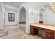 Bathroom vanity with a large mirror and beautiful tile flooring at 3680 Belvedere Park Ln, Las Vegas, NV 89141