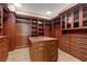 Large walk-in closet with custom shelving and drawers for ample storage at 3680 Belvedere Park Ln, Las Vegas, NV 89141