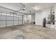 Spacious three-car garage with ample room for vehicles and storage; equipped with automatic door opener at 3680 Belvedere Park Ln, Las Vegas, NV 89141