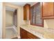 Kitchen with granite countertops, custom cabinets, and hardwood floors at 3680 Belvedere Park Ln, Las Vegas, NV 89141