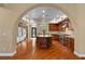 Spacious kitchen with stainless steel appliances, a center island, and hardwood floors at 3680 Belvedere Park Ln, Las Vegas, NV 89141