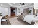 Comfortable main bedroom featuring a fireplace, built-in storage, and outdoor access at 3680 Belvedere Park Ln, Las Vegas, NV 89141