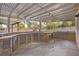 The expansive outdoor kitchen features a built-in grill, sink, and ample storage, ideal for alfresco dining at 3680 Belvedere Park Ln, Las Vegas, NV 89141