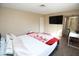 Relaxing bedroom featuring a tv, desk, ensuite bathroom and a comfortable bed at 3905 E Cherokee Ave, Las Vegas, NV 89121