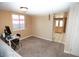 Bedroom offering neutral walls, a desk, and a view into the kitchen from the doorway at 3905 E Cherokee Ave, Las Vegas, NV 89121