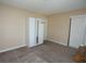 Neutral bedroom with a closet, carpeted floor, and a basketball hoop on the back of the door at 3905 E Cherokee Ave, Las Vegas, NV 89121
