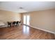 Dining room with wood floors and neutral paint next to double door at 3905 E Cherokee Ave, Las Vegas, NV 89121