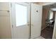 Bright entryway providing access to a bedroom with a desk and window at 3905 E Cherokee Ave, Las Vegas, NV 89121