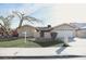 Charming single-story home with desert landscaping and a spacious driveway leading to the two-car garage at 3905 E Cherokee Ave, Las Vegas, NV 89121