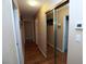 A hallway with wood floors and mirrored closet doors at 3905 E Cherokee Ave, Las Vegas, NV 89121