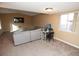 Well-lit living room with modern decor, plush carpeting, and a comfortable sofa perfect for relaxation at 3905 E Cherokee Ave, Las Vegas, NV 89121