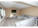 Cozy living room with neutral-toned walls, plush carpeting, and a large sectional sofa for relaxation at 3905 E Cherokee Ave, Las Vegas, NV 89121