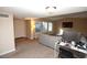 Inviting living space with comfortable seating, ample light, and a functional desk area by the door at 3905 E Cherokee Ave, Las Vegas, NV 89121