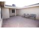Enclosed patio with three seats overlooking the backyard area, providing a relaxing outdoor space at 3905 E Cherokee Ave, Las Vegas, NV 89121