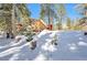 Picture of a wood storage area in the snowy backyard, close to the main house at 4165 Mont Blanc Way, Mount Charleston, NV 89124