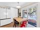 Modern kitchen with a dining area and a view of the snow covered yard at 4165 Mont Blanc Way, Mount Charleston, NV 89124