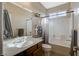 Bright bathroom with vanity, framed mirror, shower-tub combo, and decorative towels with natural lighting at 4459 S Glory Vine Ln, Pahrump, NV 89061