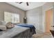 This secondary carpeted bedroom includes a window for natural light and a sliding door closet at 4459 S Glory Vine Ln, Pahrump, NV 89061