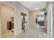 Inviting hallway leads to the laundry room on the left and transitions seamlessly into the living area at 4459 S Glory Vine Ln, Pahrump, NV 89061