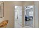 A hallway showcasing doorways to a bedroom and a bathroom, providing access to different areas of the home at 4459 S Glory Vine Ln, Pahrump, NV 89061