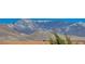 Snow-capped mountains beyond the backyard landscape providing a scenic view at 4459 S Glory Vine Ln, Pahrump, NV 89061