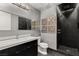 Contemporary bathroom with double vanity sinks and walk-in shower with accent tile work at 4525 Dean Martin Dr # 511, Las Vegas, NV 89103