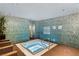 Luxurious hot tub room with serene decor, ambient lighting, and mosaic tile accents at 4525 Dean Martin Dr # 511, Las Vegas, NV 89103