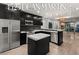 Modern kitchen featuring stainless steel appliances, a center island, and sleek black cabinetry at 4525 Dean Martin Dr # 511, Las Vegas, NV 89103