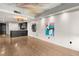 Open-concept living space featuring hardwood floors, art adorned walls, recessed lighting, and a peek into the modern kitchen at 4525 Dean Martin Dr # 511, Las Vegas, NV 89103