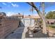 Backyard with privacy wall, storage shed, hammock, gravel, landscaping, and patio at 4647 Stearman Dr, North Las Vegas, NV 89031