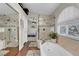 Bathroom features a large soaking tub, glass shower, and double sink vanity at 4647 Stearman Dr, North Las Vegas, NV 89031