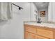 Well-lit bathroom features a modern sink with granite countertop and decorative mirror at 4647 Stearman Dr, North Las Vegas, NV 89031