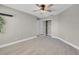 Bedroom featuring neutral tones, carpet flooring, ceiling fan and closet space at 4647 Stearman Dr, North Las Vegas, NV 89031