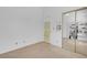 Simple room featuring a closet with mirrored doors and a door with colorful art at 4647 Stearman Dr, North Las Vegas, NV 89031