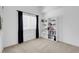 Bright bedroom features a large window, dark curtains, and a white bookshelf at 4647 Stearman Dr, North Las Vegas, NV 89031